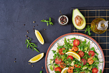 Shrimps tortilla tacos open face wrap with fresh vegetables. Healthy food. Mexican meal. Top view. Flat lay