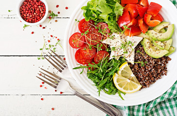Vegetarian Buddha bowl with quinoa, tofu cheese and fresh vegetables. Healthy food concept. Vegan salad. Top view. Flat lay