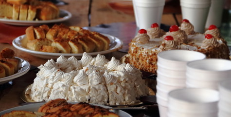 alfajores fried cakes and churros for sale at the street fair