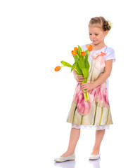 Little girl with a bouquet of tulips.