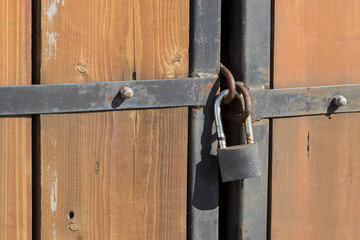 old wooden gate with lock