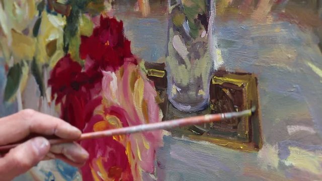 Still Life in Real Time. Art school, creativity and people concept.  Oil Painting Lesson. A painter with easel, paintbrushes and palettes pains at studio