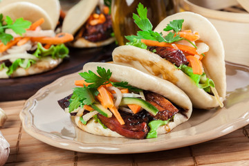 Gua bao, steamed buns with pork belly and vegetable
