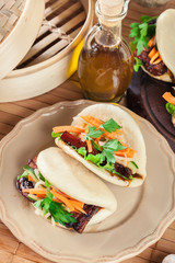 Gua bao, steamed buns with pork belly and vegetable