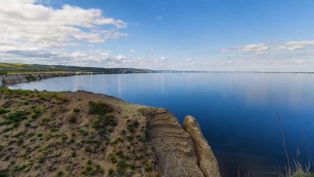 Time lapse of cloudscape with clouds passing blue sky on shore of the cliff of Stepan Razin. Cliff on the Volga River in Russia