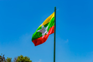 The flag pole with the flag of  Myanmar at Flagstaff Hill , Kanchanaburi in Thailand.