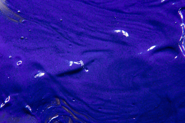 Texture of purple gouache paint is macro
