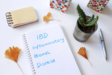 IBD Inflammatory Bowel Disease written in notebook on white table