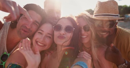 Young multi-ethnic hipster friends having fun video-calling at the beach - Powered by Adobe