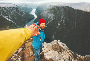 Couple adventurers in mountains follow helping hand traveling together lifestyle concept extreme...