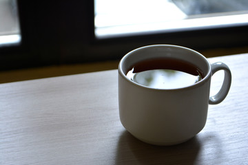 Cup of tea on table. Copy space for text