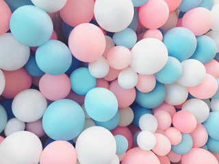 Many colorful balloons decorated wall as background