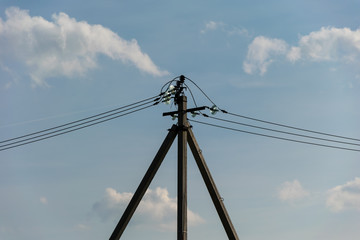 concrete electric pillar against the sky