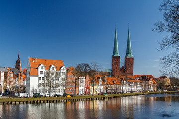 Naklejka na ściany i meble Twin bell-towers of the medieval Gothic church in Lubeck, Germany