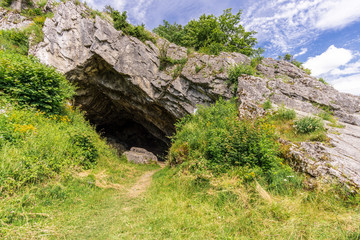 cave entry at summer clouds