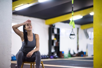 young athlete woman sitting and relaxing