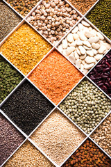 Indian Beans,Pulses,Lentils,Rice and Wheat grain in a white wooden box with cells, selective focus.