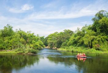 Fototapeta premium A group of men and women are rafting on the river, extreme and fun sport