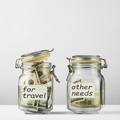 Bank for money, piggy bank, savings, for travel, vacation plans. On the table is a blue background.