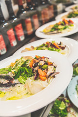 Seafood salad in a line to be served 