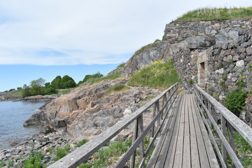 Wooden bridge on Suomenlinna island. Coastal path, Suomenlinna, Finland, 27th May 2018