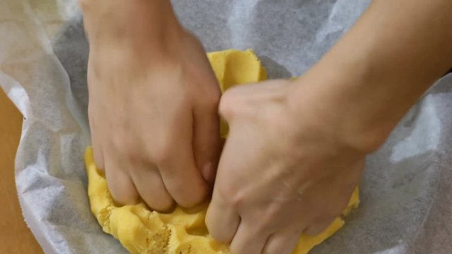 making desserts: working the fresh dough with hands