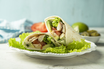 Homemade chicken, tomato and avocado wrap