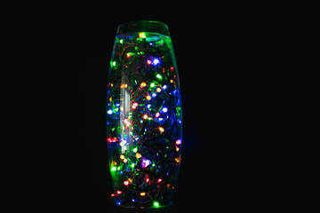 multicolored lights in a vase
