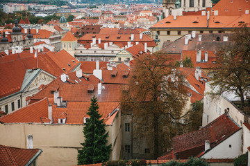 Naklejka premium Beautiful traditional houses with orange tiled roofs in Prague in the Czech Republic