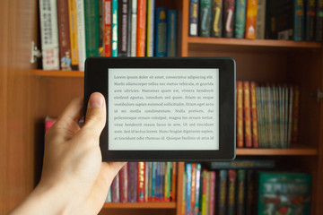 E-book in man's hand with lorem ipsum text