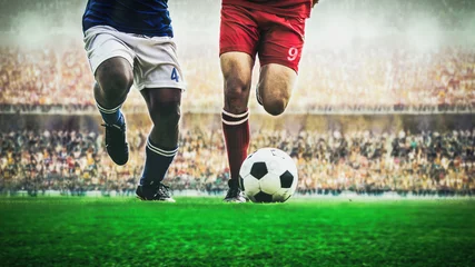 Fotobehang Bestsellers Sport Twee voetbalvoetballer die een bal dribbelen tijdens wedstrijd in het stadion