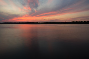Fototapeta na wymiar fantastic landscape, multicolor sky over the lake.