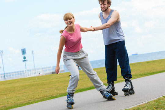 roller skater couple skating outdoor