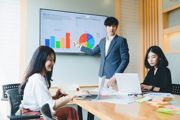 Asian business team meeting present professional investor working with new startup project. discussion and analysis data the charts and graphs. Digital tablet laptop computer design smart phone