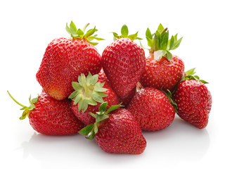 A lot of fresh strawberries on a white background.