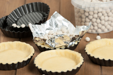 Cooking Process Of Tartlets. Ceramic Baking Beans. Tins.