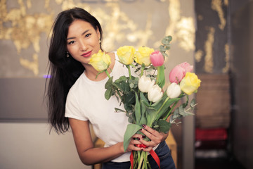 Girl holding a beautiful bouquet of flowers