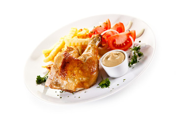 Roast chicken leg with french fries on white background