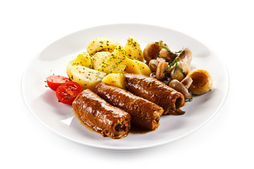 Wrapped pork chop with boiled potatoes and champignon