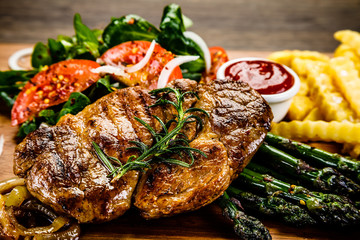 Grilled steak with french fries and vegetables