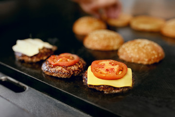 Cooking Burgers.  Meat And Buns Roasting On Grill 
