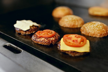 Cooking Burgers.  Meat And Buns Roasting On Grill 