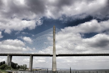 Vasco Da Gama perspectives under cloudy sky in Lisbon