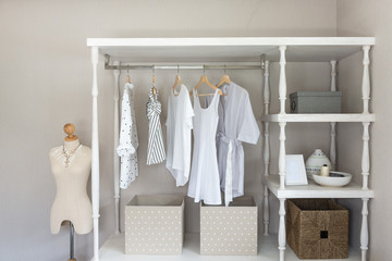 white color shirts hanging on rail