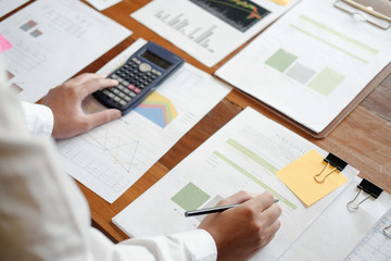 Fototapeta na wymiar Man calculate business data finance on table workplace.