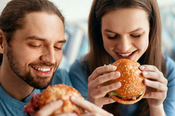 Friends Eating Burgers Indoors