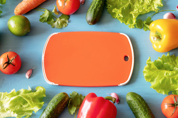 High Angle Still Life View of Knife and Wooden Cutting Board Surrounded by Fresh Herbs and...