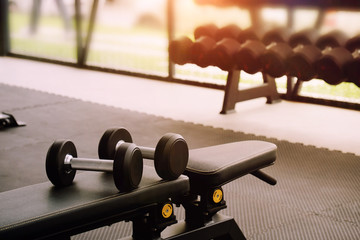 Sport equipment dumbbell in fitness gym.