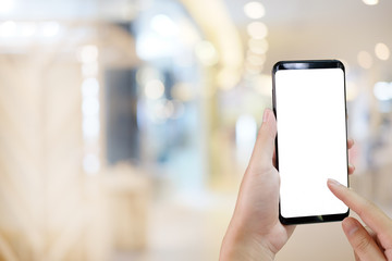 Hands touch on display smartphone screen empty for present on blur background.