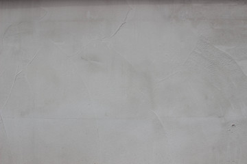gray textured concrete wall with crack, background, large view